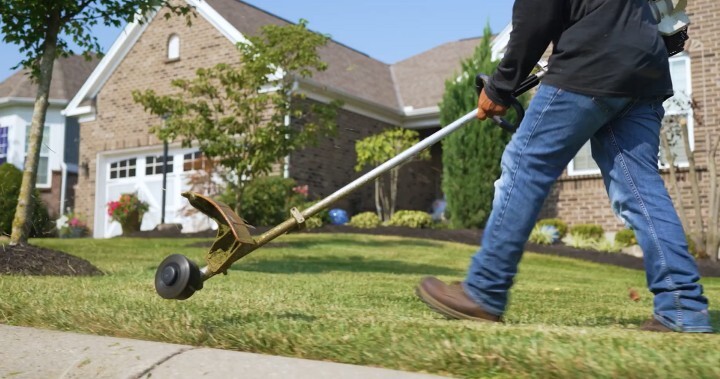 man weed eating